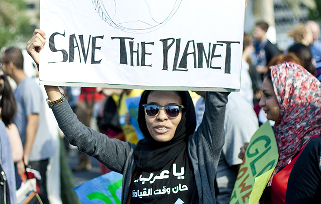 A woman marches at a climate change demonstration in Doha, December 2012. Credit: The Verb/Laura Owsianka, Flickr.