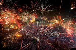 Fireworks light the sky over Tahrir Square in Cairo, Egypt, on July 3, 2013. Photo by Amr Nabil/AP.