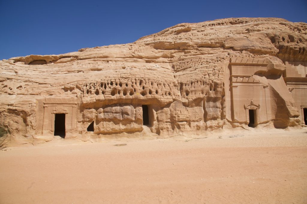tombs carved into a rock cliff