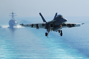 A U.S. Navy aircraft supporting operations in Iraq and Syria prepares to land in the Persian Gulf in October 2014.