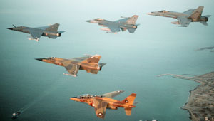 A multinational group of fighter jets, including, left to right, a French F-1C Mirage, A Qatari F-1 Mirage, A U.S. Air Force F-16C, a Qatari Alpha Jet, and a Canadian CF/A-18A Hornet, during Operation Desert Shield. Photo: U.S. Department of Defense. 