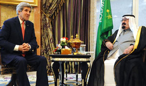 U.S. Secretary of State John Kerry speaks with Saudi Arabia's King Abdullah before their meeting at his desert encampment at Rawdat Khuraim on January 5, 2014. Photo: U.S. Department of State. 