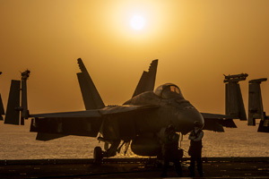 A U.S. Navy F/A-18E Super Hornet aircraft sits on the flight deck of an aircraft carrier in support of Operation Inherent Resolve against the militant group the Islamic State.