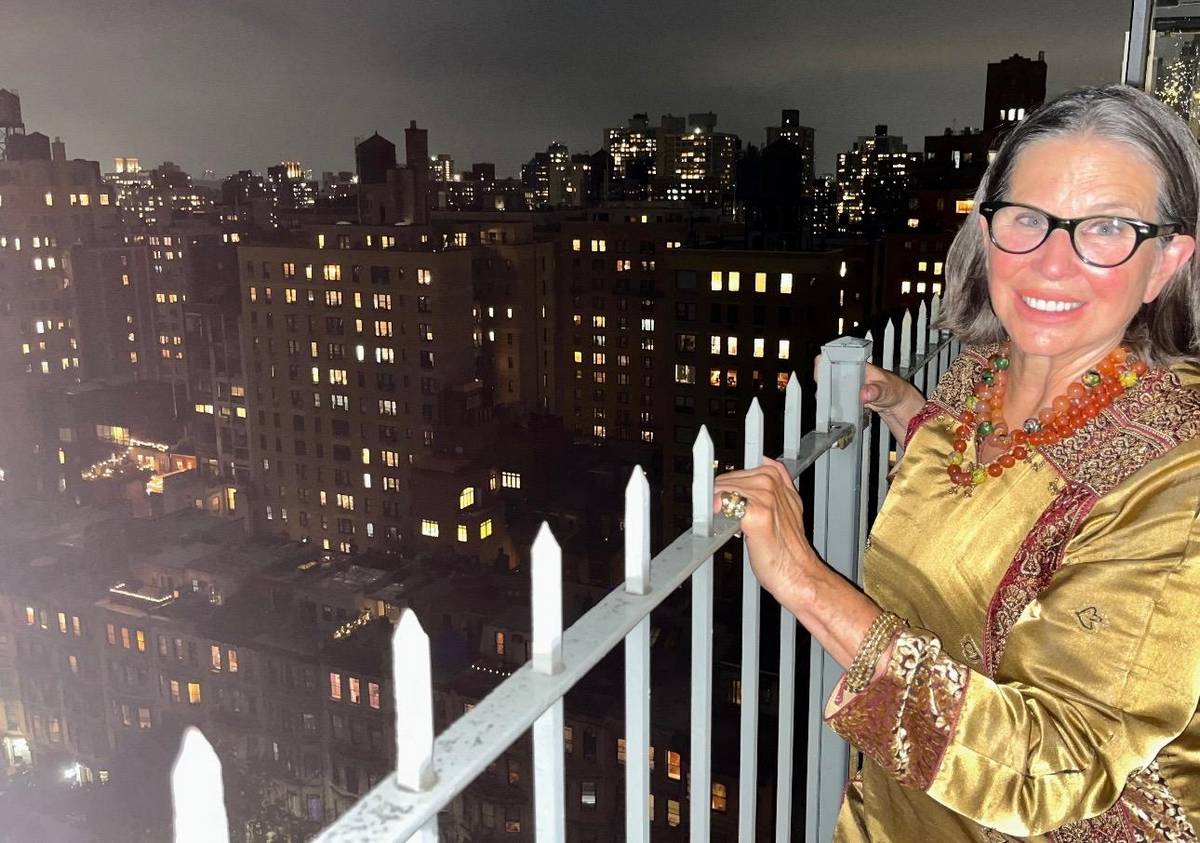 End of Evening, Paige Peterson Cooling Down Out on the Balcony, Looking towards the Hudson River Photography by Jonathon Delano 